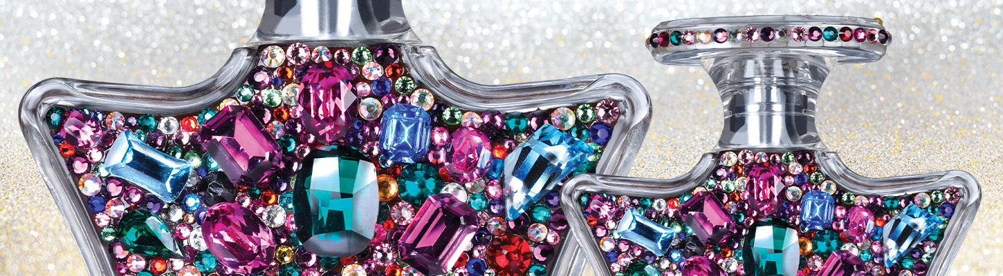 Decorative keychain with colorful crystals on a glittery background
