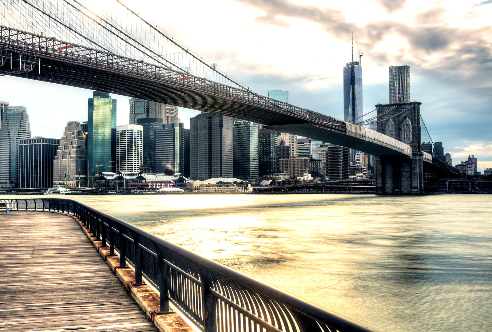Brooklyn Bridge and Manhattan skyline with a cloudy sky
