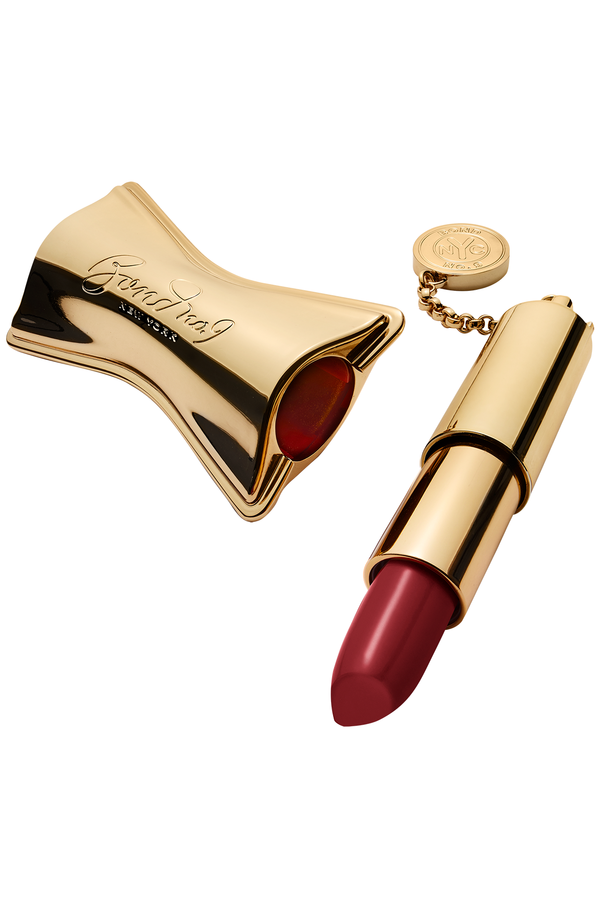 Gold lipstick case with red lipstick on a white background