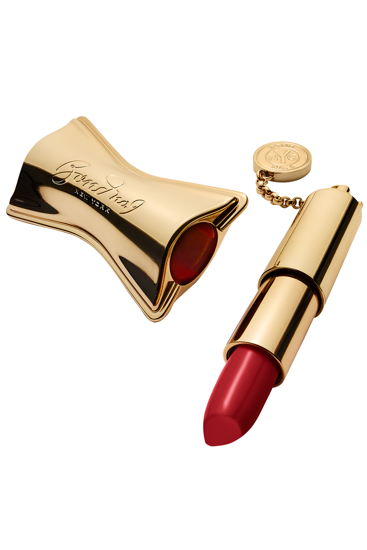 Red lipstick with gold case on a white background