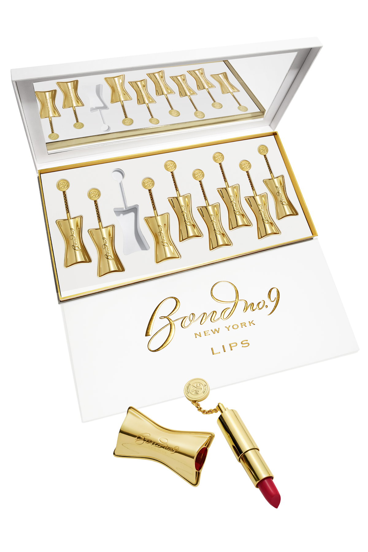Gold lipstick case with red lipstick and Bond No. 9 branding on a white background
