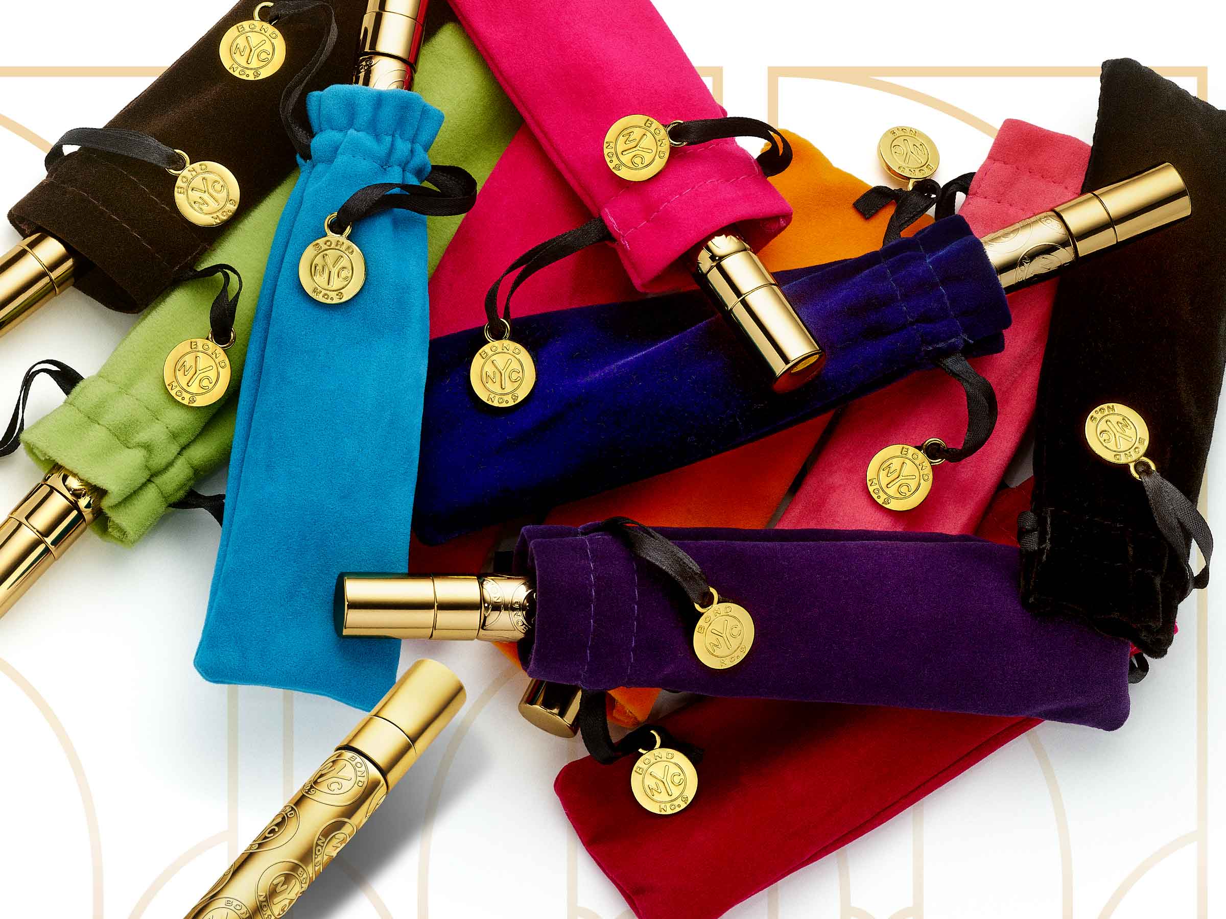 Colorful velvet bags with gold trims and decorative buttons on a white background