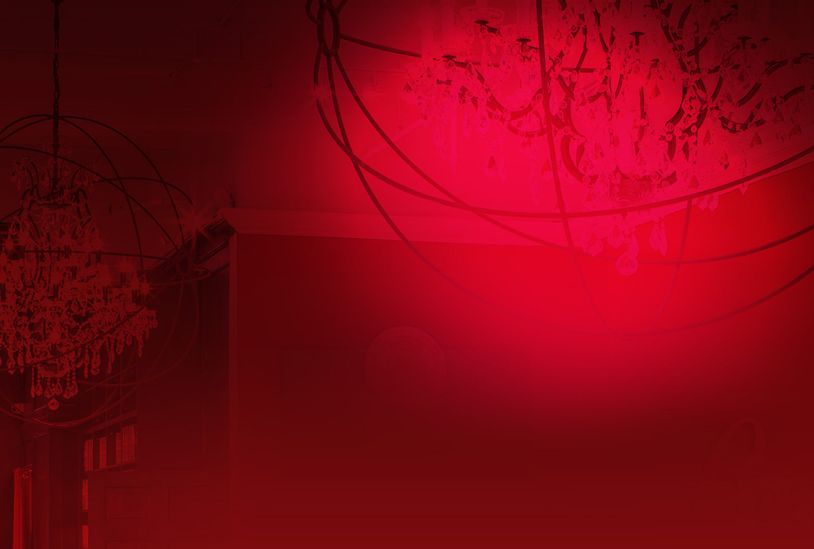 Red-themed room with chandelier and globe