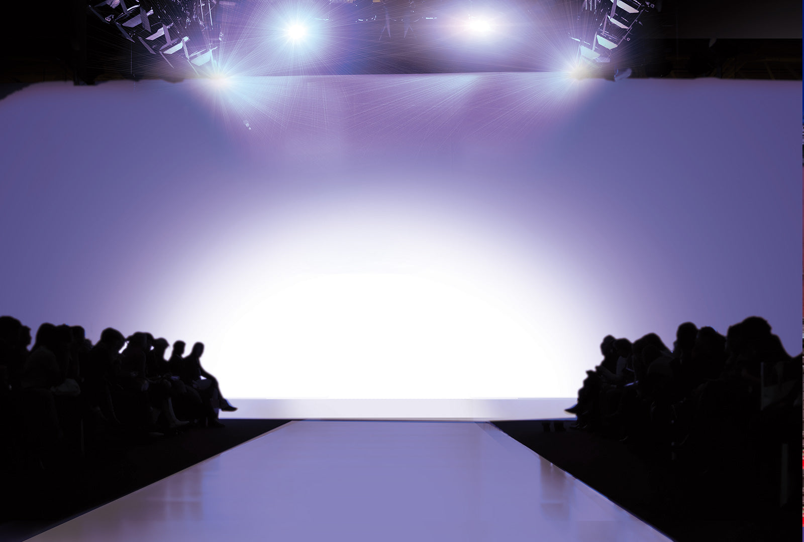 Empty runway with bright lights at a fashion show