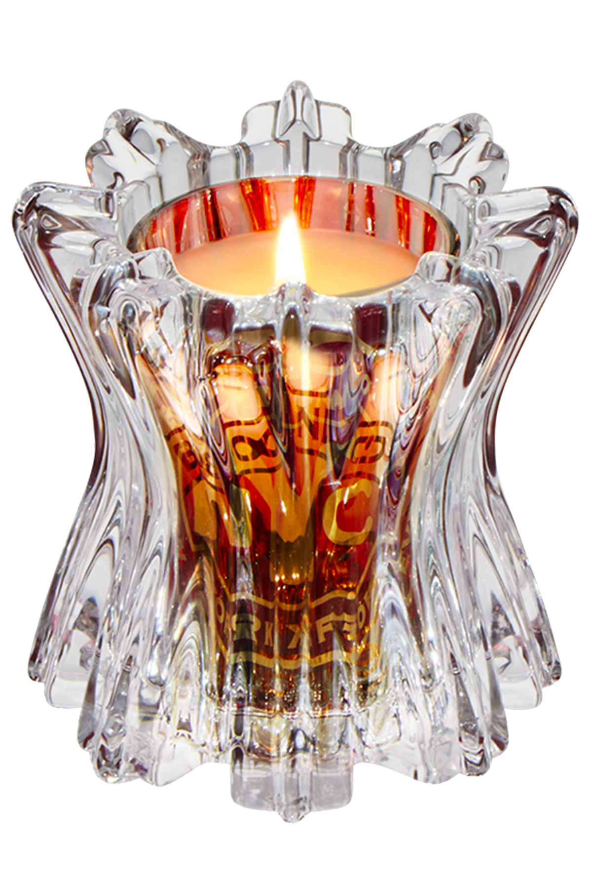 Decorative candle holder with a lit candle inside on a white background
