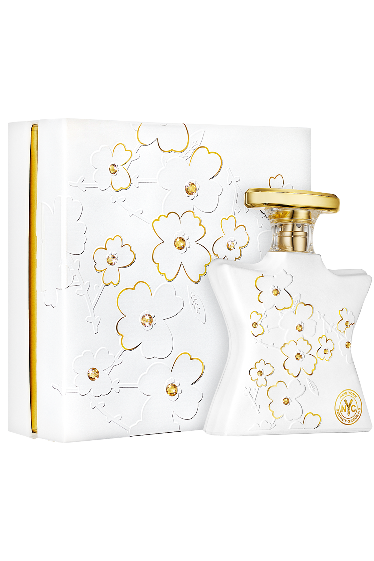 White perfume bottle and box with gold floral designs and gold swarovski stones and 'New York' text on a white background