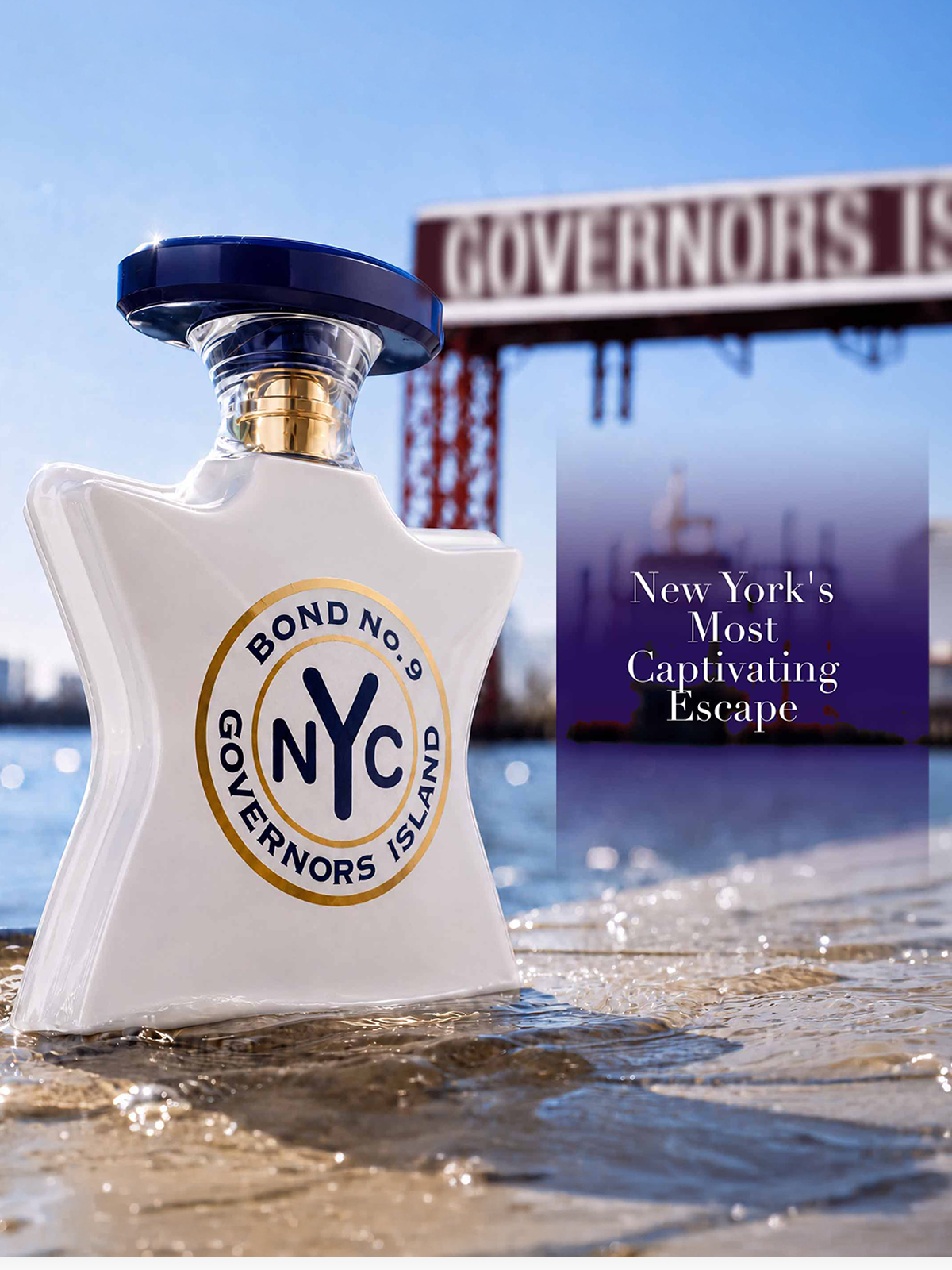 A white Bond No. 9 NYC Governor's Island escape bottle with a dark blue cap and gold neck detail, set in shallow water with a Governors Island bridge and skyline blurred in the background.